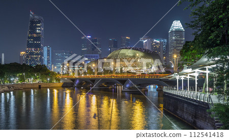 Illuminated Double Esplanade Theatres domes behind Esplanade Drive with traffic night timelapse hyperlapse Illuminated Double Esplanade Theatres domes behind Esplanade Drive with traffic night timelapse hyperlapse 112541418