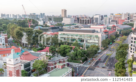 Street traffic near the fire station of Singapore day to night aerial timelapse. 112541485