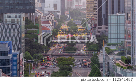 Traffic with cars on a street and urban scene in the central district of Singapore timelapse Traffic with cars on a street and urban scene in the central district of Singapore timelapse 112541497
