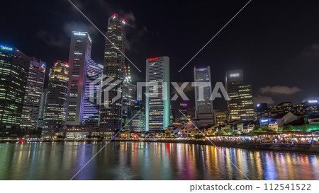 Singapore quay with tall skyscrapers in the central business district on Boat Quay night timelapse hyperlapse Singapore quay with tall skyscrapers in the central business district on Boat Quay night timelapse hyperlapse 112541522