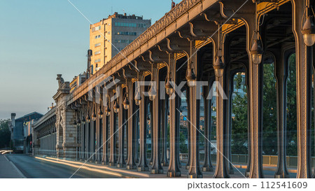Seine bridge Bir-Hakeim during sunrise timelapse in the center of Paris a beautiful summer morning, Paris, France. Seine bridge Bir-Hakeim during sunrise timelapse in the center of Paris a beautiful summer morning, Paris, France. 112541609