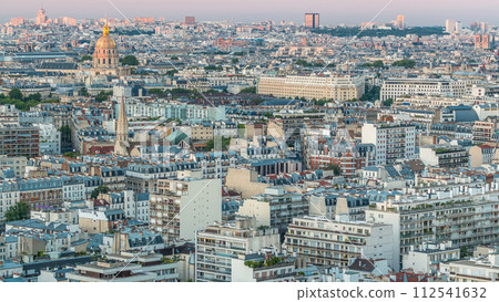Aerial panorama above houses rooftops in a Paris day to night timelapse 112541632