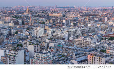 Aerial panorama above houses rooftops in a Paris day to night timelapse 112541646