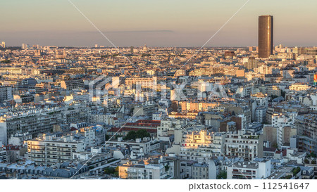 Aerial panorama above houses rooftops in a Paris day to night timelapse 112541647