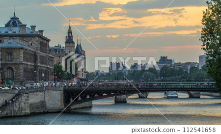 Le Pont D'Arcole bridge after sunset with boats day to night timelapse, Paris, France, Europe 112541658
