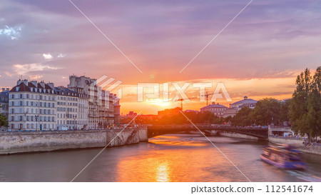 Le Pont D'Arcole bridge at sunset with people and boats timelapse, Paris, France, Europe 112541674