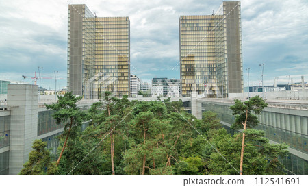 National Library of France timelapse, whose four buildings in the form of open books surround a wooded area. 112541691