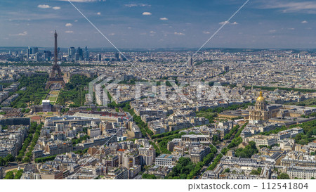 Aerial view from Montparnasse tower with Eiffel tower and La Defense district on background timelapse in Paris, France. 112541804