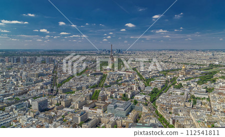 Aerial view from Montparnasse tower with Eiffel tower and La Defense district on background timelapse in Paris, France. Aerial view from Montparnasse tower with Eiffel tower and La Defense district on background timelapse in Paris, France. 112541811