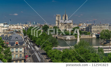 Paris Panorama with Cite Island and Cathedral Notre Dame de Paris timelapse from the Arab World Institute observation deck. France. Paris Panorama with Cite Island and Cathedral Notre Dame de Paris timelapse from the Arab World Institute observation deck. France. 112541823