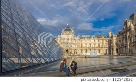 The large glass pyramid and the main courtyard of the Louvre Museum timelapse hyperlapse. Paris, France 112542022