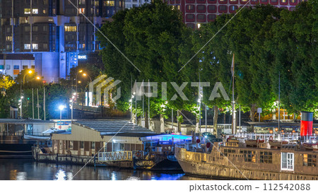 Seine river with ship in Paris at night timelapse, waterfront of the seine river in the city of Paris in france 112542088