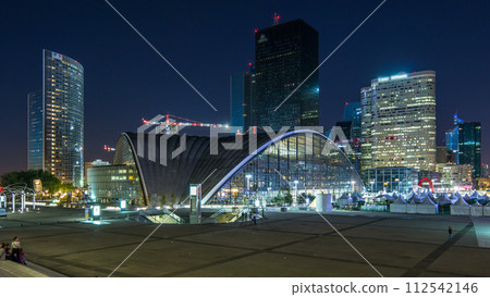 Panorama of illuminated skyscrapers timelapse in famous financial and business district of Paris - La Defense. 112542146