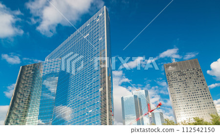 Unique skyscraper timelapse in famous financial and business district of Paris - La Defense. Unique skyscraper timelapse in famous financial and business district of Paris - La Defense. 112542150