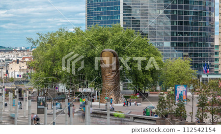 Thumb sculpture timelapse and tower block in business district Defense 112542154