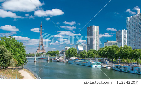 Eiffel tower at the river Seine timelapse from bridge in Paris, France 112542207