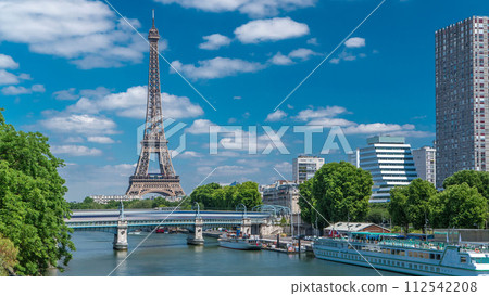 Eiffel tower at the river Seine timelapse from bridge in Paris, France 112542208