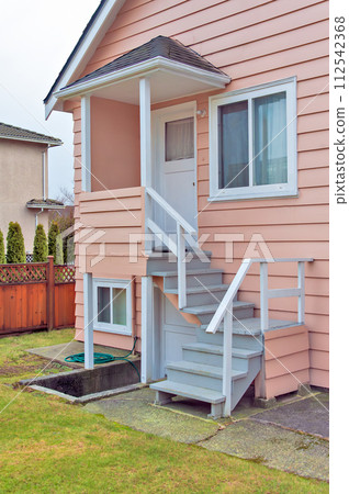 Small porch and stairs with entrance to the main and basement level 112542368