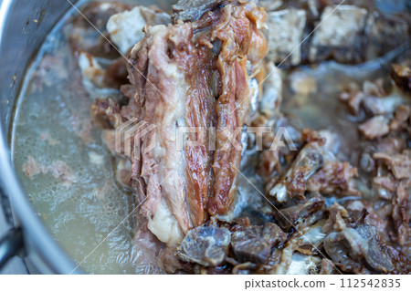 Bone and cartilage waste from butcher shops, heated dog food 112542835