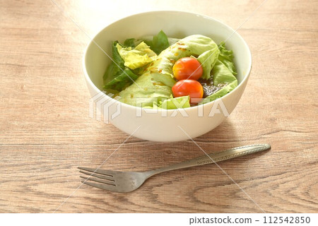 cos and tomato salad dressing Japanese sesame soy sauce on bowl cos and tomato salad dressing Japanese sesame soy sauce on bowl 112542850