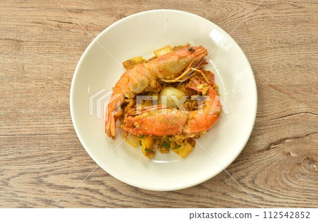 stir fried river shrimp in yellow curry and egg on plate stir fried river shrimp in yellow curry and egg on plate 112542852