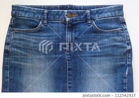 Blue jean skirt in front view on white background, closed-up studio shot. 112542917