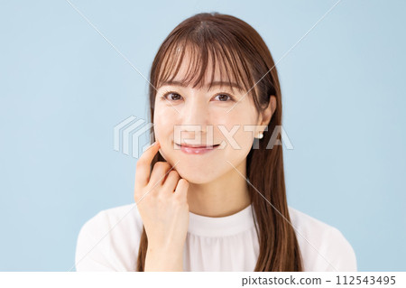 Woman blue back close up Woman blue back close up 112543495