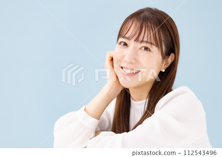 Woman blue back close up Woman blue back close up 112543496