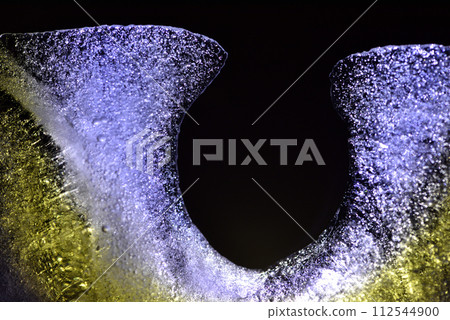Studio shot of a close-up of melting ice cubes Studio shot of a close-up of melting ice cubes 112544900