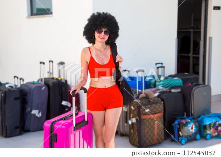 Sexy lonely woman tourist near warehouse of suitcases and luggage in hotel Sexy lonely woman tourist near warehouse of suitcases and luggage in hotel 112545032
