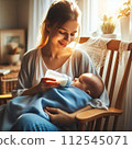 Mom feeding milk to baby00 112545071