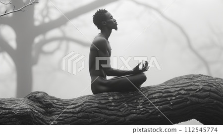 a man meditates in nature, merging with nature a man meditates in nature, merging with nature 112545774