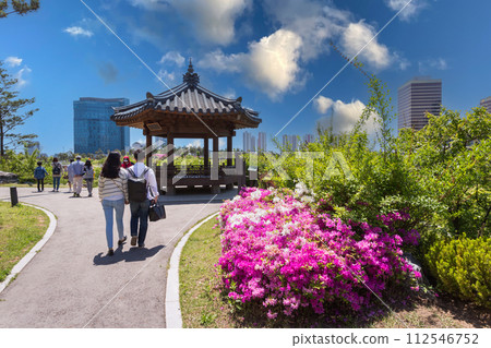 Tourists in summer at Songdo Central Park, Incheon, South Korea. Tourists in summer at Songdo Central Park, Incheon, South Korea. 112546752
