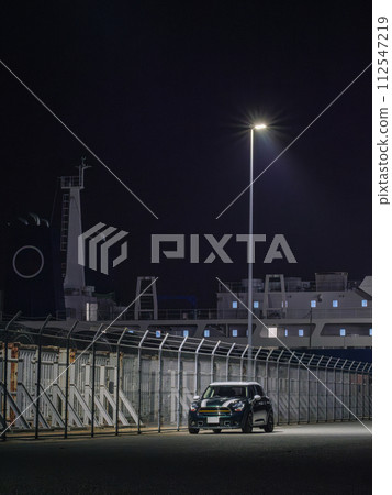 SUV parked along the harbor fence SUV parked along the harbor fence 112547219