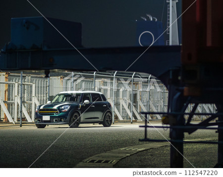 SUV parked along the harbor fence 112547220