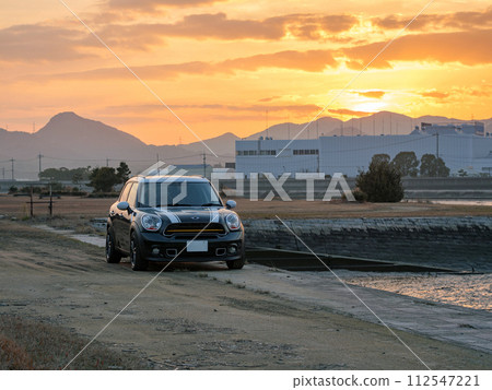 SUV parked at a boat dock at sunset SUV parked at a boat dock at sunset 112547221