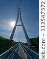 A huge bridge that shines against the blue sky 112547372