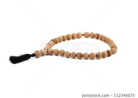 Wooden simple prayer rosary isolated on a white background. 112548873