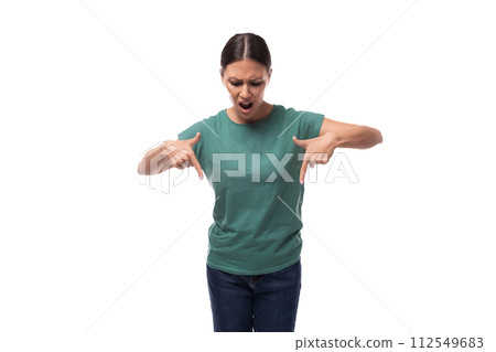 young slender brunette caucasian woman in casual clothes attracts attention with gestures young slender brunette caucasian woman in casual clothes attracts attention with gestures 112549683