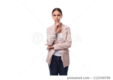young caucasian woman with a ponytail hairstyle dressed in a jacket keeps a secret 112549706