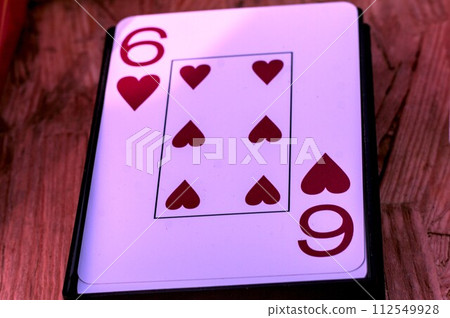 playing cards on a wooden table playing cards on a wooden table 112549928