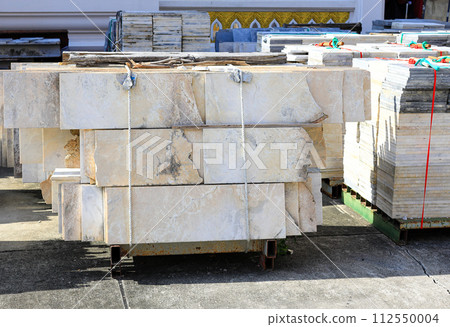 Pile or stack of marble slabs, marble tile used as materials for flooring, Preparation for construction at construction site. Pile or stack of marble slabs, marble tile used as materials for flooring, Preparation for construction at construction site. 112550004