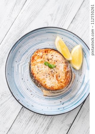 Portion of salmon medallion 112550261