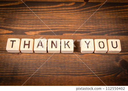 Thank You in English. Alphabet blocks on wood texture background 112550402