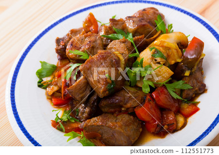 Meat stew with bell pepper, tomatoes, mushrooms  112551773