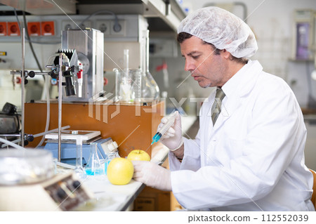Man technician working in food testing laboratory Man technician working in food testing laboratory 112552039
