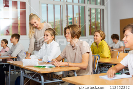 Student is sitting test and answer about task in classroom. Student is sitting test and answer about task in classroom. 112552252