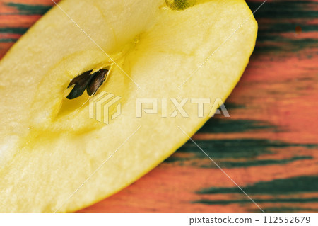 Slice of apple fruit on wooden table Slice of apple fruit on wooden table 112552679