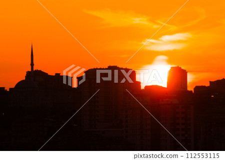 Dramatic sunset sky with the setting sun over the city, Istanbul, Turkey Dramatic sunset sky with the setting sun over the city, Istanbul, Turkey 112553115