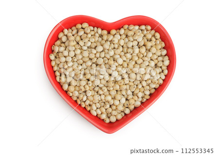 Sorghum seeds in ceramic bowl isolated on white background. Top view. Flat lay. 112553345